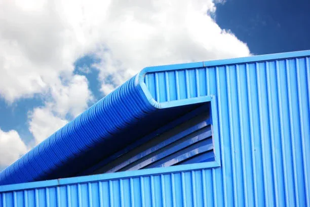 Freshly painted blue cladding and roofline on a commercial building